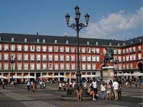 FILE PHOTO: Tourists stand outside in Plaza Mayor of Madrid, Spain September 2, 2018