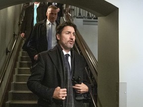 Prime Minister Justin Trudeau leaves after convening a meeting with the Incident Response group on Parliament Hill Friday.