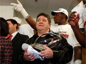 FILE PHOTO: Former San Francisco 49ers owner Edward J. DeBartolo, Jr. holds the NFC championship trophy as he congratulates players in the locker room after the 49ers defeated the Atlanta Falcons in the NFL NFC Championship football game in Atlanta, Georgia January 20, 2013.
