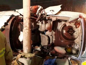 A vehicle sits on its side at the scene of a crash at Baseline Road and Woodroffe Avenue on Thursday, Feb. 6, 2020. Ottawa Paramedic Service