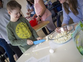 Ten-year-old Quinn Viers during a cooking class for a group of children on the on the autism spectrum at CHEO Sunday, March 1, 2020.   Ashley Fraser/Postmedia