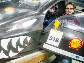 Justine Boudreau and Simon Tremblay with Bruce, the electric-powered vehicle, at the University of Ottawa. The two, along with the rest of the team, had hoped to take Bruce to Sonoma, California, to compete in the Shell Eco-marathon Americas. The event was canceled due to the novel coronavirus.  Ashley Fraser/Postmedia