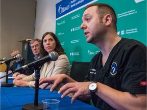 Dr. Andrew Willmore of the Ottawa Hospital briefs reportes on COVID-19 as the medical officer of health, Dr. Vera Etches, and Mayor Jim Watson look on.