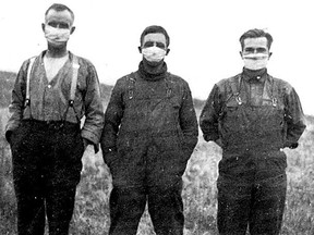 Three prairie farmers wear masks to ward off the Spanish flu that killed thousands in 1918.