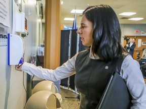 Mayor Valérie Plante takes a squirt of hand sanitizer after meeting reporters for an update on the COVID-19 crisis in Montreal on Thursday March 19, 2020.