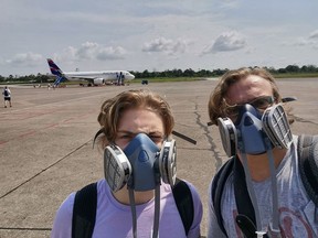 Samson and Alexander Boldizar prepare to board an evacuation flight from Iquitos, Peru to Miami.