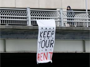 A banner hangs from the Laurier Avenue Bridge during the COVID-19 pandemic recently.