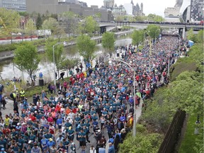 Runners leave the start of the 10k run at the Ottawa Race Weekend on Saturday, May 25, 2019.