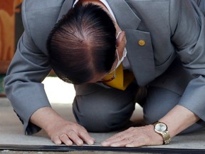 Lee Man-hee, founder of the Shincheonji Church of Jesus the Temple of the Tabernacle of the Testimony, does a deep bow during a news conference at its facility in Gapyeong, South Korea, March 2, 2020.