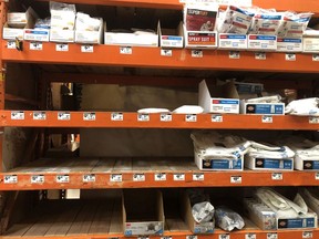Shelves where protective masks were once displayed sit empty at a Home Depot store on March 2, 2020 in San Rafael, Calif. Montreal pharmacies are seeing a similar run on protective masks as well, even though medical authorities say healthy people don't need them.