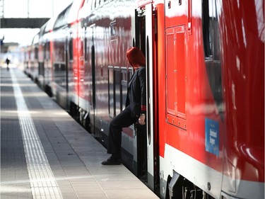 A train steward waits in a Regional Train at Munich Main Train Station Hauptbahnhof Muenchen on March 15, 2020 in Munich, Germany. As the number of confirmed cases of coronavirus infection continues to rise daily across Germany so is the impact of the virus on everyday life. Businesses are increasing home office work, airlines are decreasing their flight capacity, schools with cases of the virus are closing temporarily, some sports events are void of spectators, shops are selling out of disinfectants and large-scale public events are being cancelled.
