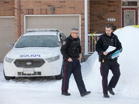 Police maintain a secure perimeter around a townhome in east end of Orléans.
