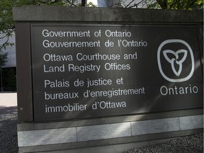 A file photo of a sign at the Ottawa courthouse on Elgin Street.