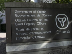 A file photo of a sign at the Ottawa Courthouse on Elgin Street.