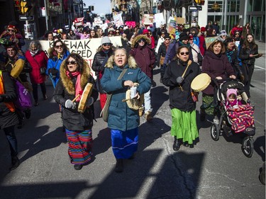 Those taking part in Saturday's march for International Women's Day make their way from Parliament Hill to city hall.