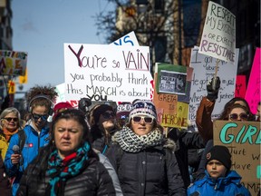 Those taking part in Saturday's march for International Women's Day make their way from Parliament Hill to city hall.