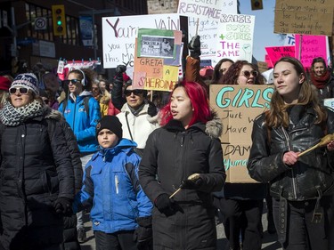 Those taking part in Saturday's march for International Women's Day make their way from Parliament Hill to city hall.