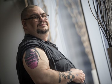 The Capital Comic Book Convention was held at the Delta hotel Sunday March 8, 2020. Fredric Tremblay took a minute away from his search through comics for a photo to show off his tattoo.   Ashley Fraser/Postmedia