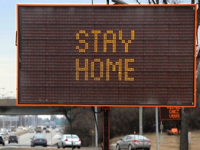 Portable signs along Hwy. 17 encourage people to stay home because of COVID-19.