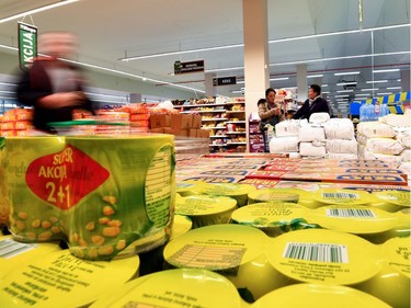 Sarajevo residents shop at a city supermarket to stock up on groceries, on March 14, 2020, in Sarajevo, fearing that a total lockdown will be imposed as a measure to prevent the spread of the new Coronavirus, COVID-19.