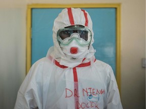 A doctor gets ready with protective gears before visiting the ward for quarantined people who had close contacts with the first Kenyan patient of the COVID-19 at the Infectious Disease Unit of Kenyatta National Hospital in Nairobi, Kenya, on March 15, 2020, during the COVID-19 outbreak, caused by the novel coronavirus. - Kenya announced on March 13, 2020, the first confirmed case of coronavirus in East Africa, as the region so far unscathed by the global pandemic scaled up emergency measures to contain its spread. A 27-year-old Kenyan woman tested positive for the virus on March 12 in Nairobi, a week after returning from the United States via London.
