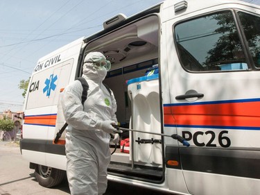 A paramedic prepares to disinfect a house during a coronavirus drill, in Escobedo Nuevo Leon, Mexico.