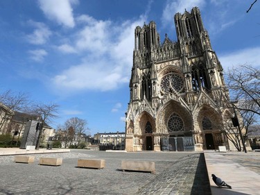 A strict lockdown comes into in effect in France to stop the spread of COVID-19. The square in front of the Notre-Dame de Reims cathedral in Reims stands empty.