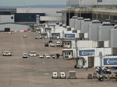 Travel restrictions due to the coronavirus pandemic have resulted in deserted parking bays at Manchester Airport, in Manchester in north west England on Tuesday, March 17, 2020.