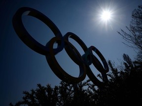 The Olympic Rings logo is pictured in front of the headquarters of the International Olympic Committee (IOC) in Lausanne on March 18, 2020, as doubts increase over whether Tokyo can safely host the summer Games amid the spread of the COVID-19.