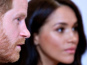 (FILES) In this file photo taken on October 15, 2019 Britain's Prince Harry, Duke of Sussex, and Britain's Meghan, Duchess of Sussex.