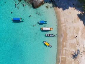 FILE: Aerial shot of a beach and some boats.
