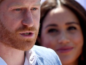 Files: Britain's Prince Harry, Duke of Sussex, gives a speech as his wife Meghan, Duchess of Sussex, looks on, during a visit to the Youth Employment Services (YES) Hub in Tembisa township, near Johannesburg, South Africa, October 2, 2019.