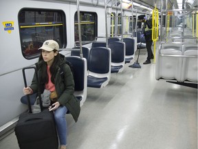 A loan traveller rides the sky train bound for Vancouver International Airport.