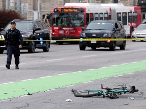 Ottawa Police block off the area where a cyclist was struck on Laurier Avenue near Elgin Street Thursday (May 16, 2019) morning. The driver of the vehicle that has left the cyclist with critical head injuries kept going and then abandoned the vehicle.