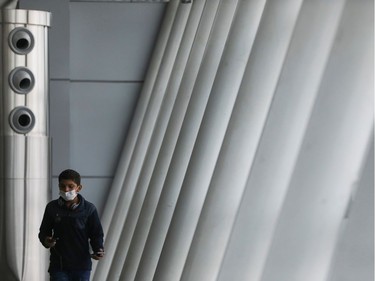 A boy wears a protective face mask, amid coronavirus fears, at the Juscelino Kubitschek airport in Brasilia, Brazil March 15, 2020.