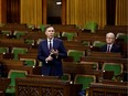 Finance Minister Bill Morneau speaks in the House of Commons as legislators convene to give the government power to spend billions of dollars in emergency cash. Only a few MPs were required to be present.
