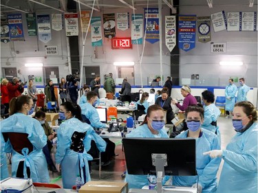 Medical staff prepare to receive patients for coronavirus screening at a temporary assessment center at the Brewer hockey arena in Ottawa, Ontario, Canada March 13, 2020.