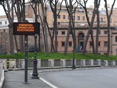 An empty street with a banner that reads "Coronavirus emergency, #I stay at home" is pictured as the Italian government continues restrictive movement measures to combat the coronavirus outbreak, in Rome, Italy March 14, 2020.