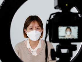 SSUNZY, a beauty content YouTuber, records YouTube video clips on makeup tutorials catered to those wearing masks, following the outbreak of the coronavirus disease (COVID-19), at a studio in Seoul, South Korea, March 17, 2020.