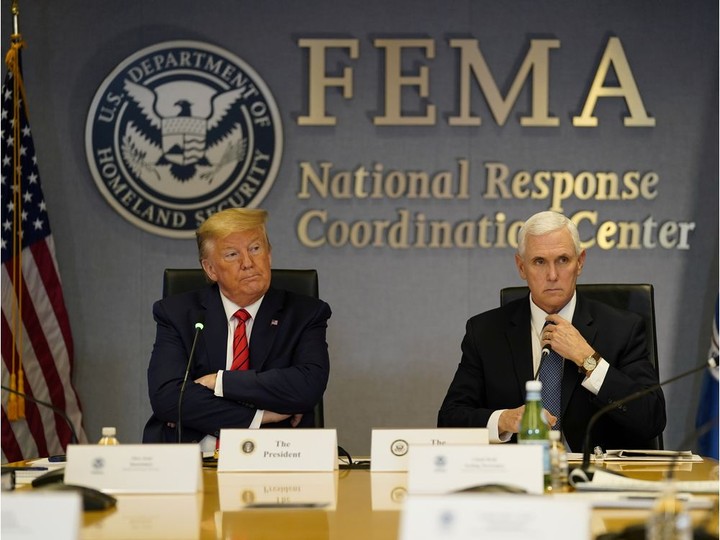  U.S. President Donald Trump and Vice-President Mike Pence attend a teleconference with governors to discuss partnerships to “prepare, mitigate and respond to COVID-19” at the headquarters of the Federal Emergency Management Agency (FEMA) on March 19.