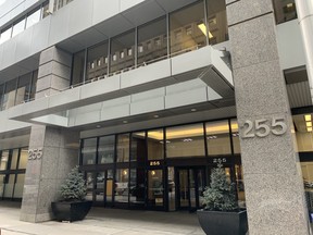 Signs posted on the office doors of the Superintendent of Financial Institutions’ downtown Ottawa offices at 255 Albert St. warn their 360 employees to work from home as of Thursday, Mar. 12, while an employee has been in contact with the COVID-19 virus.