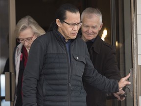 Wet'suwet'en hereditary leader Chief Woos, also known as Frank Alec, centre, Minister of Crown-Indigenous Relation, Carolyn Bennett, left, and B.C. Indigenous Relations Minister Scott Fraser arrive to address the media in Smithers, B.C., on March 1.