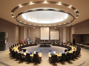 Ottawa Mayor Jim Watson speaking to an almost empty council chambers in Ottawa Wednesday March 25, 2020.