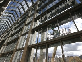 A window washer works at the National Art Gallery of Canada, in this file photo.