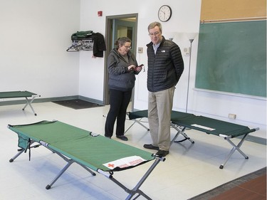 Mayor Jim Watson tours the isolation centre for vulnerable residents ahead of its opening on Monday with Wendy Muckle, executive director of Ottawa Inner City Health.