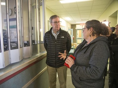 Mayor Jim Watson tours the isolation centre for vulnerable residents ahead of its opening on Monday with Wendy Muckle, executive director of Ottawa Inner City Health.