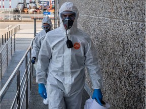 Members of Spain's military emergencies unit (UME) arrive for a deep clean operation at the border inspection point at the Port of Barcelona in Barcelona, Spain, on Friday, March 20, 2020. The novel coronavirus has claimed 235 lives in Spain over the past 24 hours as the death toll surged past 1,000 almost a week into a nationwide lockdown.