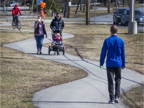 Pedestrians are seen walking along the Byron Street path April 6.