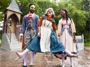 Christopher Allen, left, and Tiffany Martin, right, hoist up Lisa Cormier, centre, as they perform a scene from Odyssey Theatre's production of The Amorous Servant in Strathcona Park on Friday, July 14, 2017.