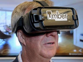 Ottawa mayor Jim Watson uses virtual reality goggles to tour a home. COVID-19 restrictions mean virtual home tours are the wave of the immediate future for prospective buyers.